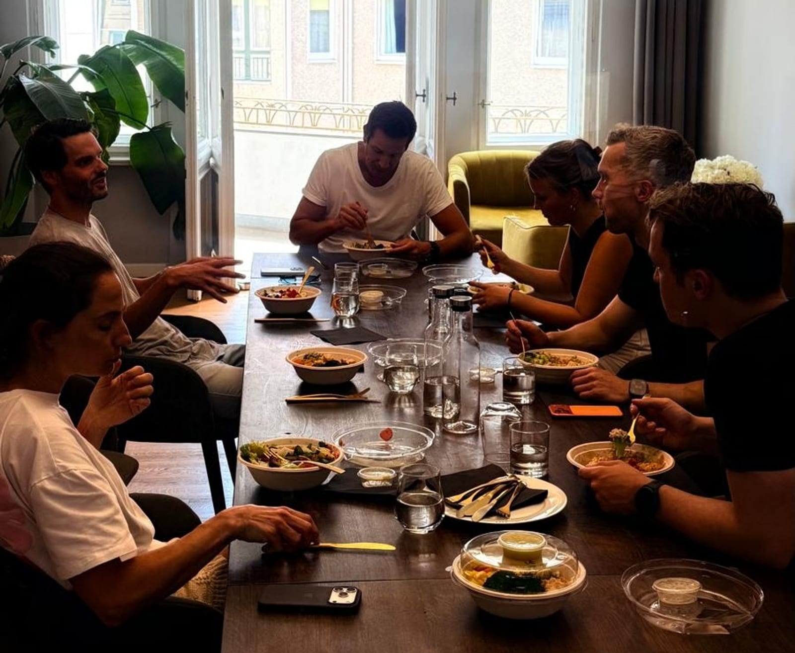 Members having Tuesday Office Lunch at the long table